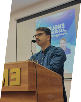 A teacher helping a student in a classroom setting.